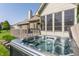 Backyard view of a relaxing hot tub in a well-maintained outdoor space at 10784 Giselle Way, Fishers, IN 46040