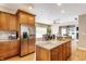Kitchen island with granite countertops and stainless appliances at 10784 Giselle Way, Fishers, IN 46040