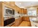Gourmet kitchen featuring granite countertops, stainless appliances, and custom cabinetry at 10784 Giselle Way, Fishers, IN 46040