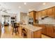 Spacious kitchen with granite counters, stainless appliances, and hardwood floors at 10784 Giselle Way, Fishers, IN 46040