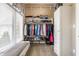 Organized walk-in closet with ample shelving, clothing racks, and a window for natural light at 10784 Giselle Way, Fishers, IN 46040