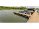 Scenic waterfront view featuring a private dock and boat lifts, perfect for enjoying lake activities at 10784 Giselle Way, Fishers, IN 46040