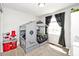 Playful bedroom with unique house-shaped bed, gray curtains, and a toy kitchen at 10876 Trailwood Dr, Fishers, IN 46038