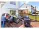 Relaxing outdoor wood deck with lounge seating, privacy screening, and views of the surrounding landscape at 10876 Trailwood Dr, Fishers, IN 46038