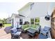 Outdoor wood deck featuring patio seating, a privacy screen, and access to an outdoor grill and green space at 10876 Trailwood Dr, Fishers, IN 46038