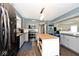 Modern kitchen with stylish gray cabinetry, stainless steel appliances, and an island at 10876 Trailwood Dr, Fishers, IN 46038