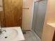 Bathroom featuring tiled floors, walk-in shower, single sink, and vanity at 121 W Fordice St, Lebanon, IN 46052