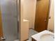 Bathroom featuring tiled floors, walk-in shower, single sink, and vanity at 121 W Fordice St, Lebanon, IN 46052