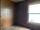 Bedroom with brown wood paneling and a single window at 121 W Fordice St, Lebanon, IN 46052