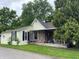 Charming home with a stone-accented porch, complimented by mature trees in a pleasant neighborhood at 121 W Fordice St, Lebanon, IN 46052