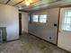 Cozy living room featuring wood-look flooring and a white painted walls with natural light from the exterior window at 121 W Fordice St, Lebanon, IN 46052