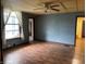 A spacious living room featuring laminate floors, light walls and an abundance of natural light at 121 W Fordice St, Lebanon, IN 46052