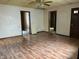 A spacious living room featuring laminate floors, light walls and multiple entrances at 121 W Fordice St, Lebanon, IN 46052