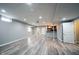 Basement with vinyl floors, a wet bar, and multiple doors leading to other rooms at 12600 Misty Ridge Ct, Fishers, IN 46037