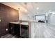 Finished basement with a wet bar, granite countertops, brick accent wall and entertainment area at 12600 Misty Ridge Ct, Fishers, IN 46037
