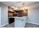 Basement bar area with granite countertops, brick backsplash, and storage cabinets at 12600 Misty Ridge Ct, Fishers, IN 46037