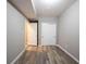 Finished basement featuring an open doorway, neutral paint, closet, and modern wood grain flooring at 12600 Misty Ridge Ct, Fishers, IN 46037