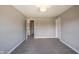 Bedroom featuring a neutral color scheme, a window, and a door at 12600 Misty Ridge Ct, Fishers, IN 46037