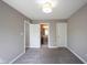 Bedroom with gray carpet and access to an ensuite bathroom, perfect for relaxation at 12600 Misty Ridge Ct, Fishers, IN 46037