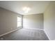 Neutral bedroom featuring a window for natural light and soft gray carpeting at 12600 Misty Ridge Ct, Fishers, IN 46037