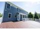 Expansive backyard deck attached to a home with large windows, offering a perfect space for outdoor living at 12600 Misty Ridge Ct, Fishers, IN 46037