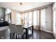 Bright dining room with a wooden table, chandelier, and floor-to-ceiling windows at 12600 Misty Ridge Ct, Fishers, IN 46037