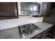 Close up of kitchen featuring gas range and stainless steel microwave at 12600 Misty Ridge Ct, Fishers, IN 46037
