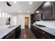 Sleek kitchen featuring modern appliances, a spacious island, and dark wood cabinetry at 12600 Misty Ridge Ct, Fishers, IN 46037