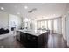 Bright open kitchen featuring a large island, stainless appliances, and modern fixtures at 12600 Misty Ridge Ct, Fishers, IN 46037