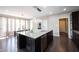 Contemporary kitchen with island, stainless steel appliances, and an adjacent dining area at 12600 Misty Ridge Ct, Fishers, IN 46037