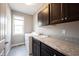 This laundry room includes front loading machines, ample counter space and storage at 12600 Misty Ridge Ct, Fishers, IN 46037