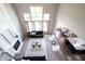 Spacious living room featuring large windows and a cozy fireplace at 12600 Misty Ridge Ct, Fishers, IN 46037