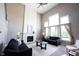 A bright living room with high ceilings, large windows and fireplace at 12600 Misty Ridge Ct, Fishers, IN 46037