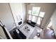 A cozy living room featuring large windows, fireplace, and high ceilings at 12600 Misty Ridge Ct, Fishers, IN 46037