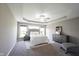 Main bedroom boasting a tray ceiling, plush carpet, and neutral walls at 12600 Misty Ridge Ct, Fishers, IN 46037