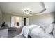 Spacious bedroom features a tray ceiling, carpet, and en-suite bathroom and closet at 12600 Misty Ridge Ct, Fishers, IN 46037