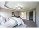 Main bedroom displaying tray ceiling, neutral walls, carpet, and en-suite bathroom and closet at 12600 Misty Ridge Ct, Fishers, IN 46037