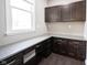 This home office space has a large window and built in shelves and drawers at 12600 Misty Ridge Ct, Fishers, IN 46037