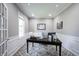 Bright home office featuring a patterned rug, ample natural light, and wainscoting at 12600 Misty Ridge Ct, Fishers, IN 46037