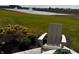 Inviting backyard setting with a comfortable chair and lush landscaping at 1310 Foxtail Ln, Greenwood, IN 46143