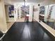 Finished basement featuring exercise equipment, mirrors, and a large open space, perfect for a home gym or recreation area at 13497 Dunes Dr, Carmel, IN 46032