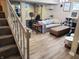 Basement area with stairs, featuring a comfortable seating area and exercise equipment, great for a functional living space at 13497 Dunes Dr, Carmel, IN 46032