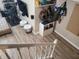 A basement with a staircase, featuring storage and seating areas, with a view of exercise equipment in the distance at 13497 Dunes Dr, Carmel, IN 46032