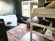 Unique bedroom featuring a loft bed, study area, and modern decor at 13497 Dunes Dr, Carmel, IN 46032