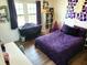 Cozy bedroom with purple accents, ample natural light, and hardwood flooring at 13497 Dunes Dr, Carmel, IN 46032