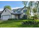 Charming two-story home with a well-manicured lawn, attached garage and tasteful landscaping, perfect for suburban living at 13497 Dunes Dr, Carmel, IN 46032