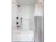Modern bathroom featuring a tub with a shower, white subway tile surround and a shower curtain at 140 Meridian Hills Blvd, Indianapolis, IN 46260