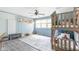 Bright bedroom featuring a wooden bunk bed and a large window allowing plenty of natural light at 140 Meridian Hills Blvd, Indianapolis, IN 46260
