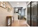 Spacious foyer featuring hardwood floors, a staircase, and neutral wall color, offering a welcoming atmosphere at 140 Meridian Hills Blvd, Indianapolis, IN 46260