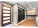 Foyer with modern front door, coat closet, and open space, providing a welcoming first impression at 140 Meridian Hills Blvd, Indianapolis, IN 46260